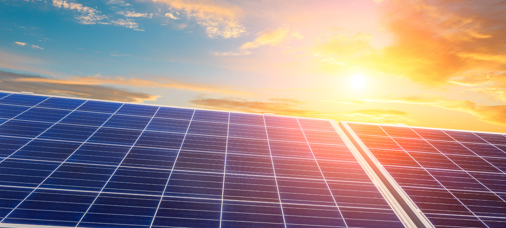 A beautiful scene of solar panels at sunset, capturing the last rays of the day and reflecting the eco-friendly power of renewable energy