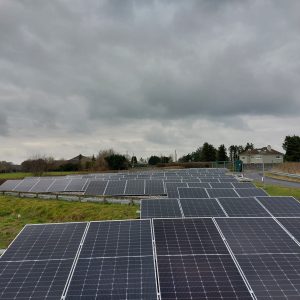 solar panels on the ground at a toll plaza